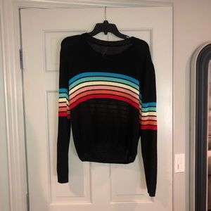 Black knit sweater with rainbow stripes